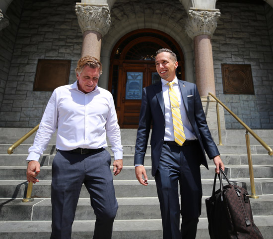 Personal Injury Attorney Ruldolph WM. SOHL, Esq. walking and talking with a client